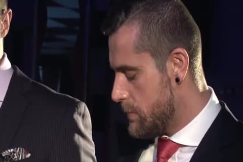 Two chaps In Suits Meet In A Bar