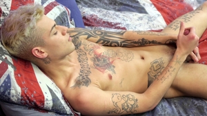 Inked-Up Cock Takes Center Stage on Cam